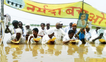 Protesting Indian farmers stand in chest-deep water for 11 days