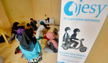 Indonesia's Muslim women hail female-only motorbike taxis