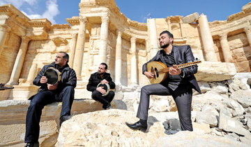 Atop Palmyra’s damaged theater, Syrian musicians sing of return