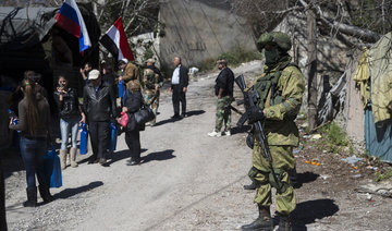 Syrian rebels, families begin leaving Homs district in deal with government