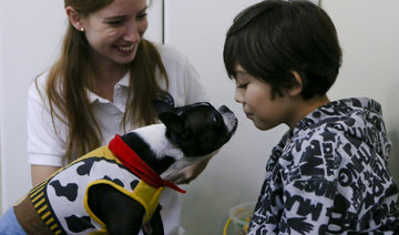 In Chile, dogs help kids with autism on their dentist visits