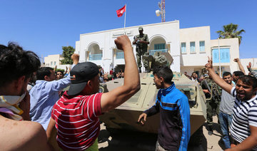 Protests turn violent in south Tunisia; police stations burned, one killed