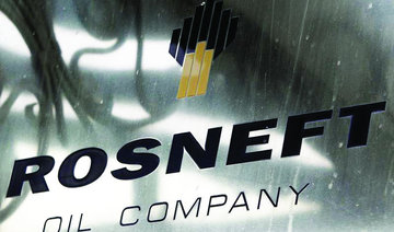 Rosneft profits held back by output pact, weaker prices