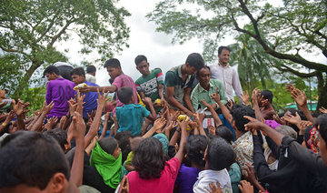 Rohingya refugees forced to scramble for aid in Bangladesh