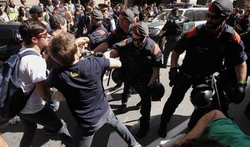 Clash over Catalan vote heats up in Spain as police swoop in