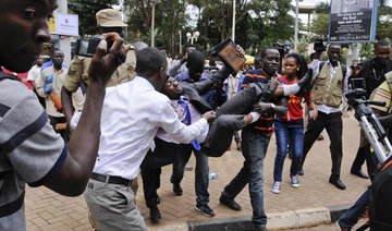 Uganda MPs ejected from parliament as row over term limit bill gets physical