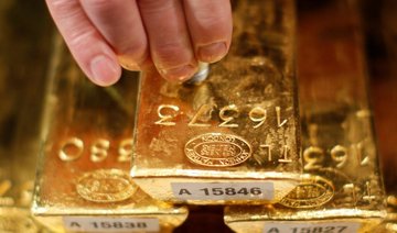 Gold touches $1,300, glittering all the way to best year since 2010