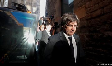 Spain warns Catalan leader against swearing-in from Brussels