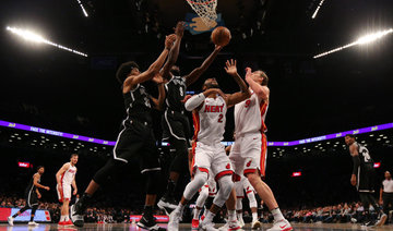 DeMarre Carroll scores 26, leads Nets past Heat, 101-95