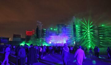 People attend the Soundstorm music festival, organized by MDLBEAST, in Riyadh on December 16, 2021. (AFP)