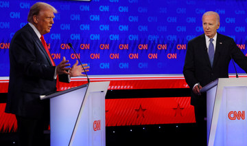 US President Joe Biden listens former US President Donald Trump speaks during their debate in Atlanta, June 27, 2024. (REUTERS)