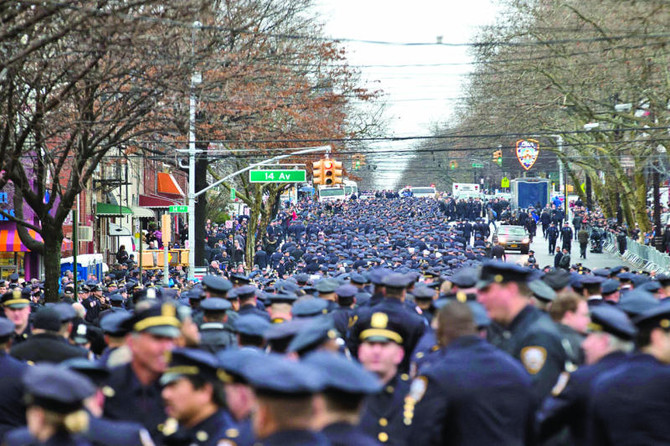 Thousands gather to mourn slain New York police officer