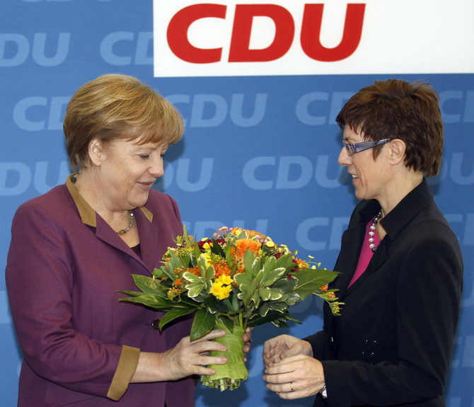 Merkel’s party easily beats center-left in state poll