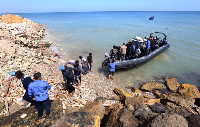 Migrants who clung to boat rescued off Libya, 7 bodies found