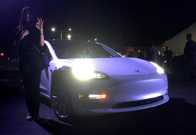 Elon Musk hands over first Tesla Model 3 electric cars to early buyers