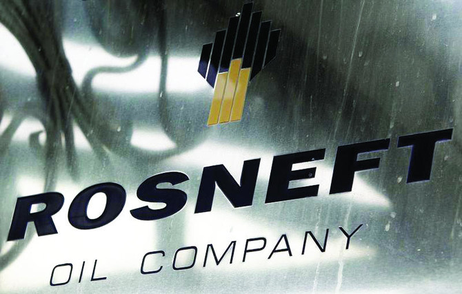 Rosneft profits held back by output pact, weaker prices