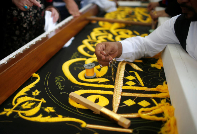 Saudi factory stitches gold-laced cover for Islam’s holiest site