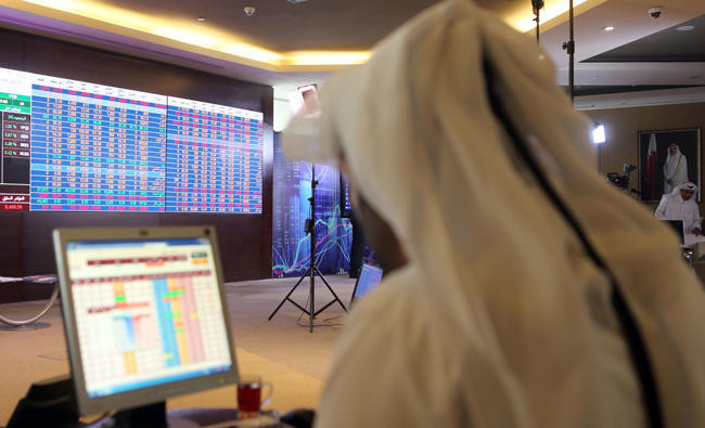 Qatar falls after Fitch downgrade, Qalaa helps Egypt