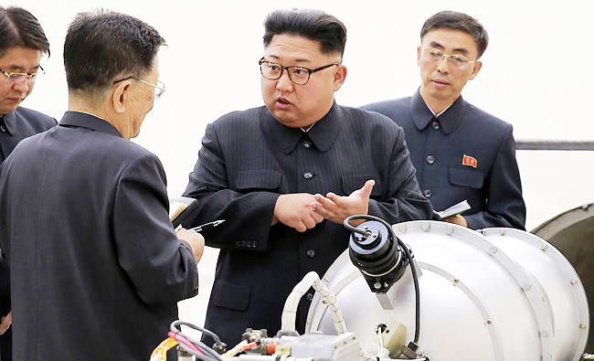 North Korea leader says he will complete nuclear program