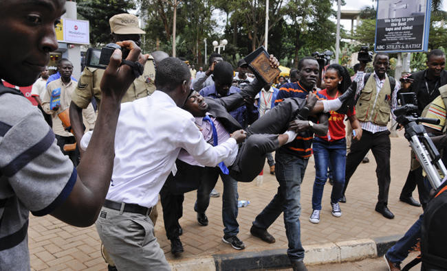 Uganda MPs ejected from parliament as row over term limit bill gets physical