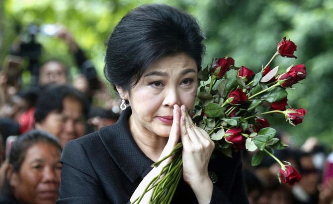 Thailand revokes passports of exiled former PM Yingluck