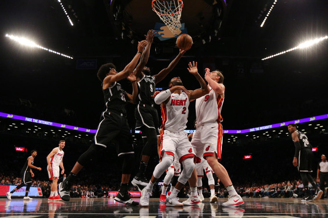 DeMarre Carroll scores 26, leads Nets past Heat, 101-95