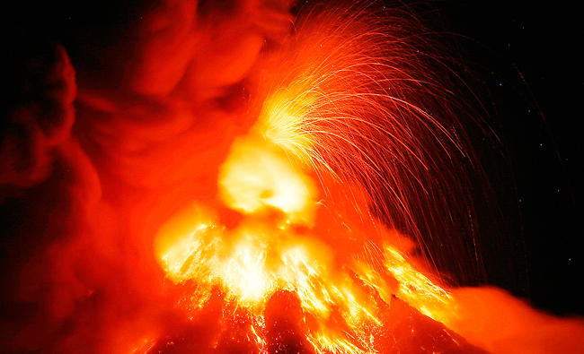 Philippine volcano spews fountains of lava, big ash plumes