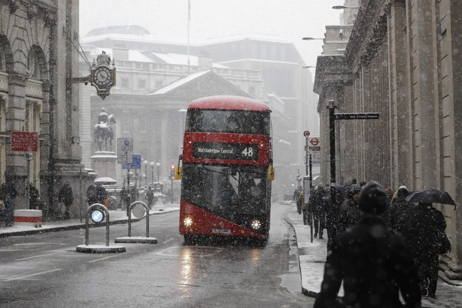 Europe weather: UK army sent out; Dutch ice skate on canals