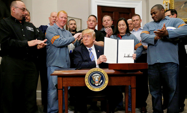 Trump orders stiff trade tariffs, unswayed by grim warnings