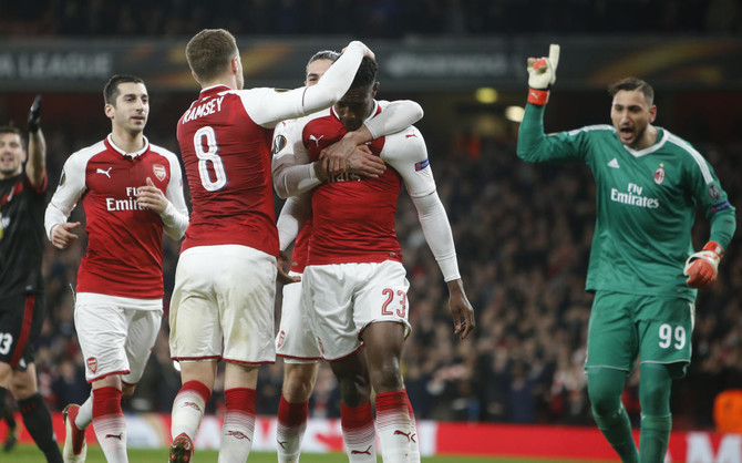 Welbeck double helps Arsenal past Milan, Dortmund dumped out