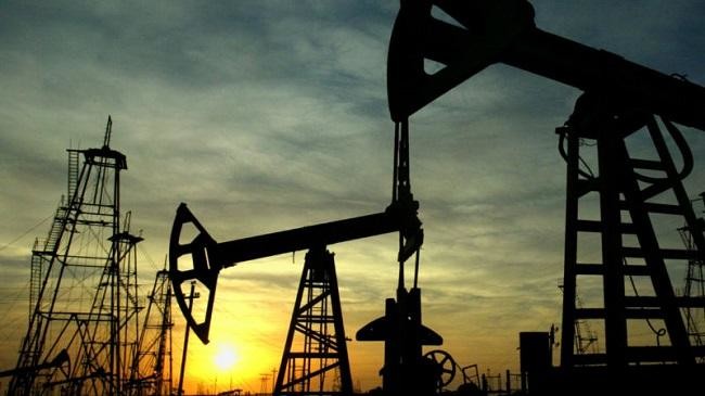 Oil prices fall as increased US drilling points to higher output