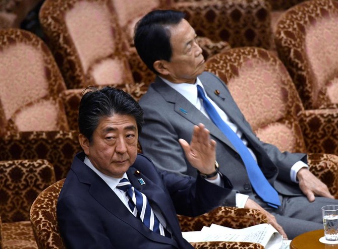 Japan’s embattled PM Abe hits back over scandal as support plunges