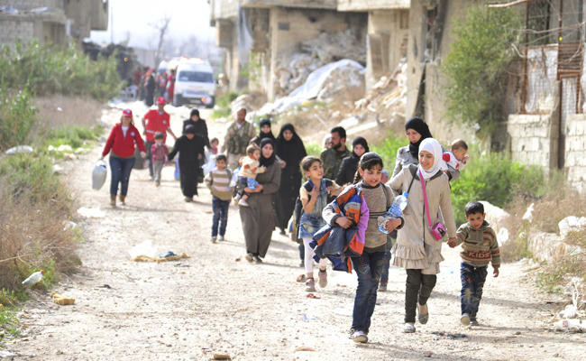 Beginning of the end for Ghouta rebels: Thousands flee relentless regime assault