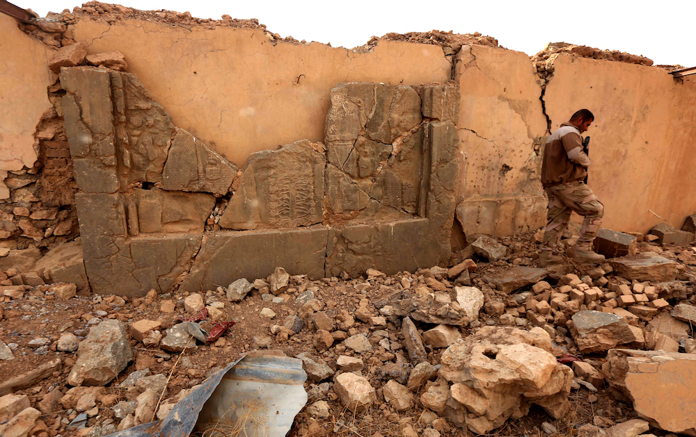 An Iraqi army soldier walks across the ancient ruins of Nimrud following the recapture of the ancient town on the outskirts of Mosul from Daesh extremists. (AFP/File Photo)